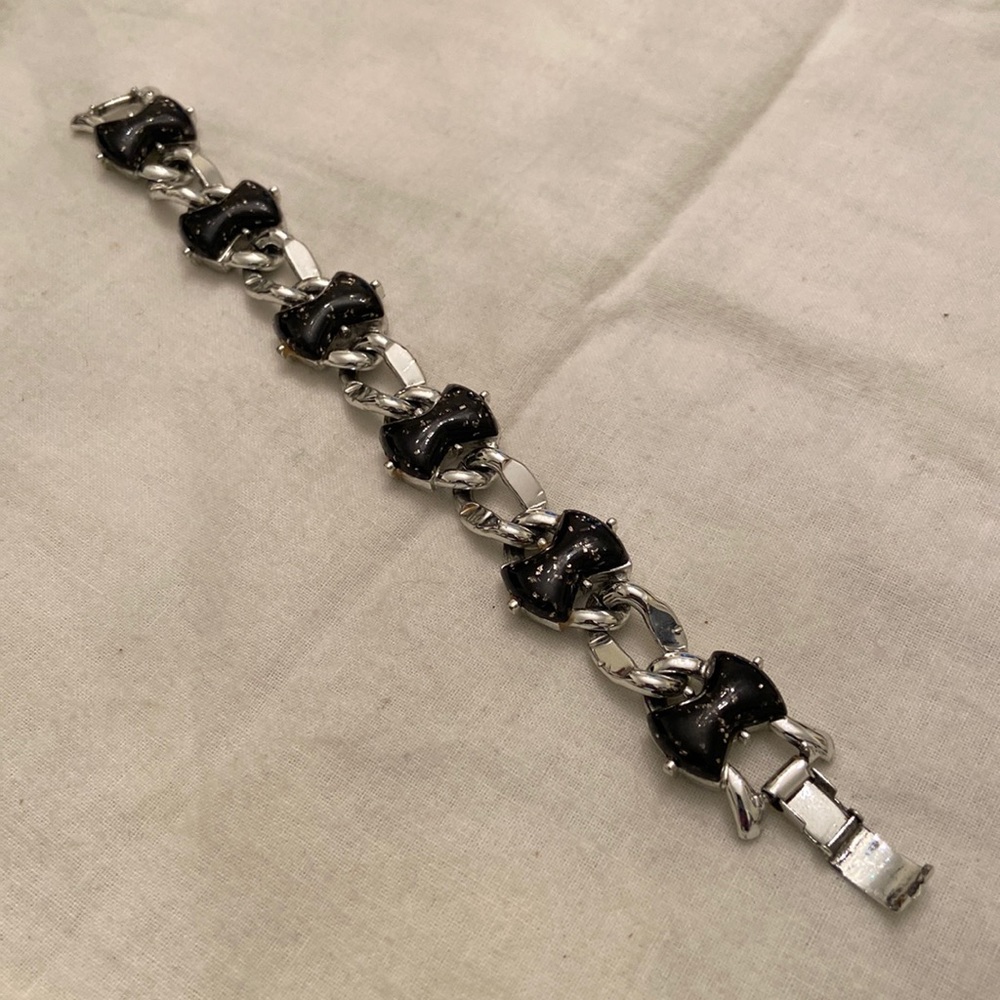 Wonderful lucite confetti curb link bracelet. Black lucite w tiny gold confetti.